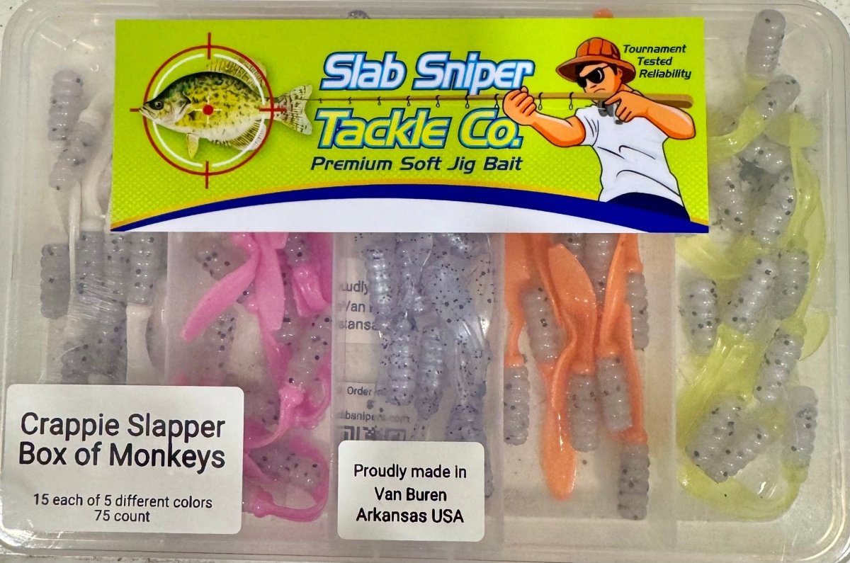 Small plastic box with different colors of crappie jigs. Slab sniper logo on the lid