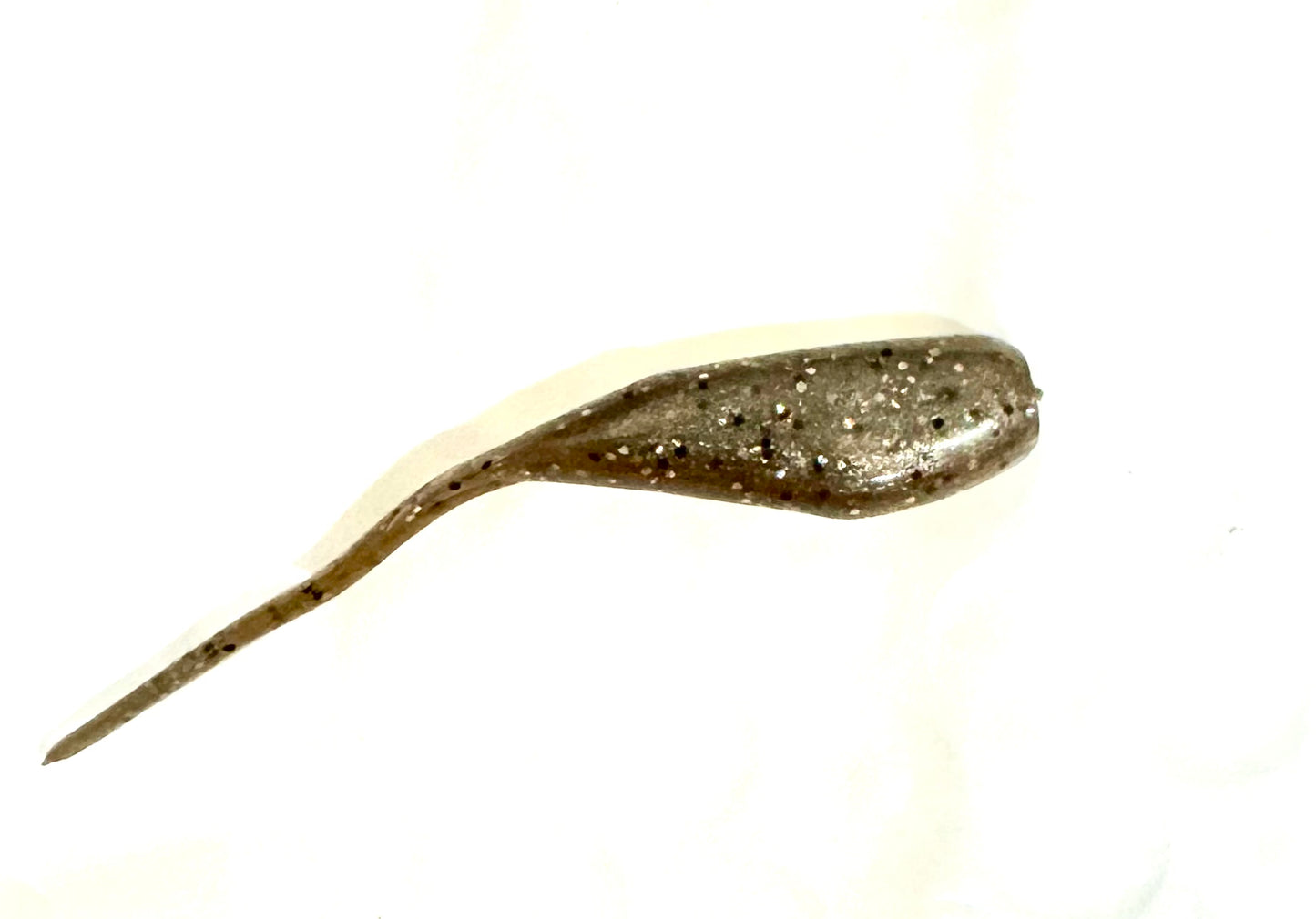 Minnow shaped soft plastic crappie jigs solid gold brown tint with silver, black, and red glitter