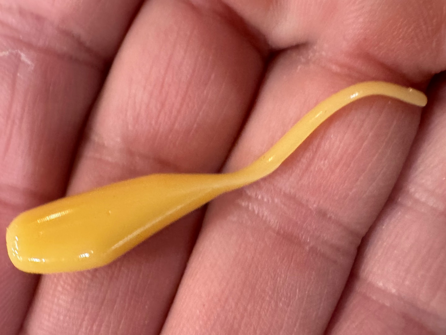 Minnow shaped soft plastic crappie jigs in a creamy off white solid color