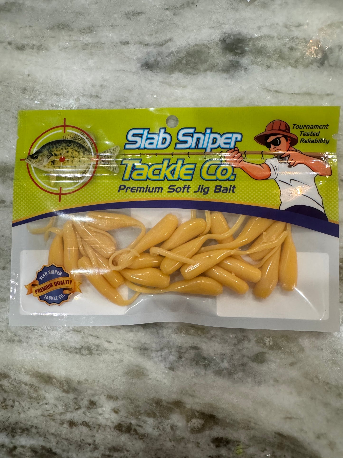 A package of slab Sniper brand Minnow shape soft plastic crappie jigs in a creamy off white solid color