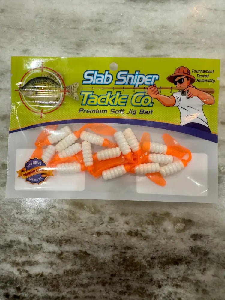 Package of slab Sniper Crappie jigs green background logo of a fisherman aiming his fishing pole at a crappie in crosshair