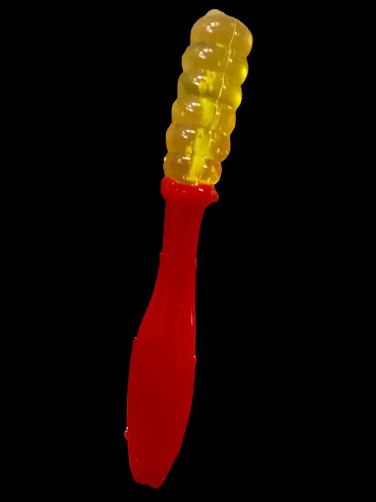 Soft plastic Crappie jig 2 inches long with a translucent chartreuse head and a bright red flat beaver tail