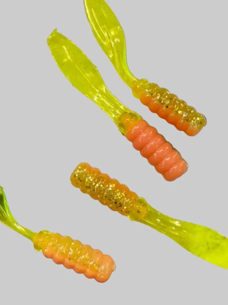 Soft plastic Crappie jig with a two color pink and silver glitter chartreuse head and chartreuse flat beaver tail