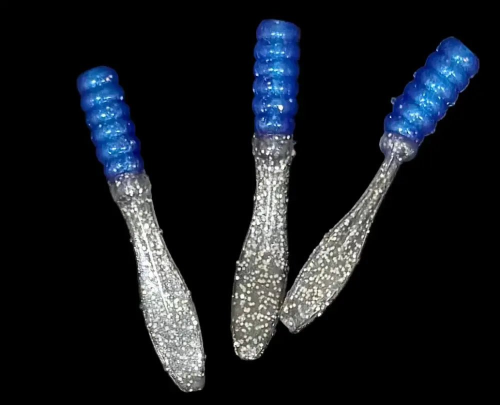 Soft plastic Crappie jig 2 inches long with a blue head and shinny metallic silver flat beaver tail