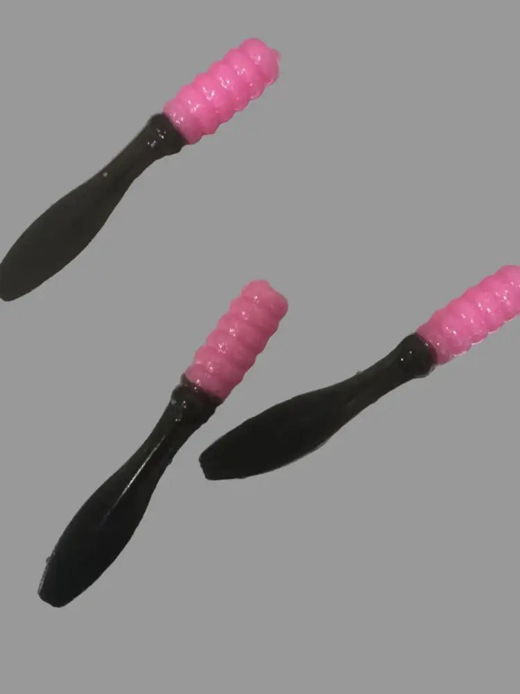 Soft plastic Crappie jig 2 inches long with a pearl pink head and black flat beaver tail