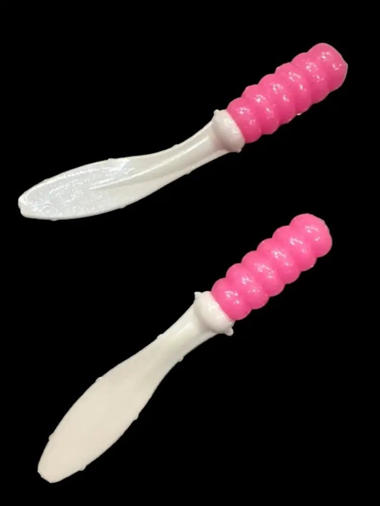Soft plastic Crappie jig 2 inches long with a pink head and pearl white flat beaver tail