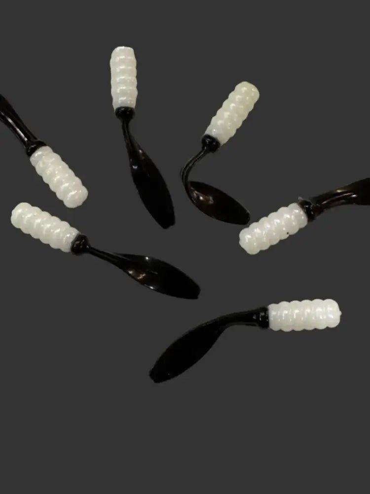 Soft plastic Crappie jig 2 inches long with a Pearl white head and black flat beaver tail