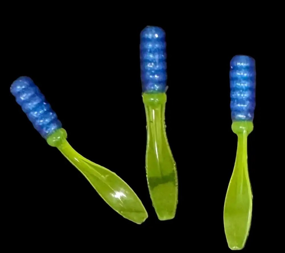 plastic Crappie jigs 2 inches long with a light blue head with silver glitter and a translucent chartreuse flat beaver tail